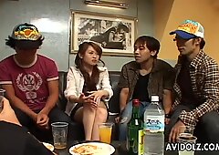 Hot Japanese girl strips for a group of guys