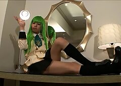 Sexy green wig on a Japanese tranny fingering her asshole