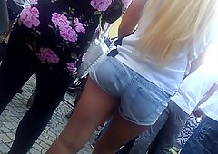 Blonde babe in shorts has no idea her ass is getting filmed